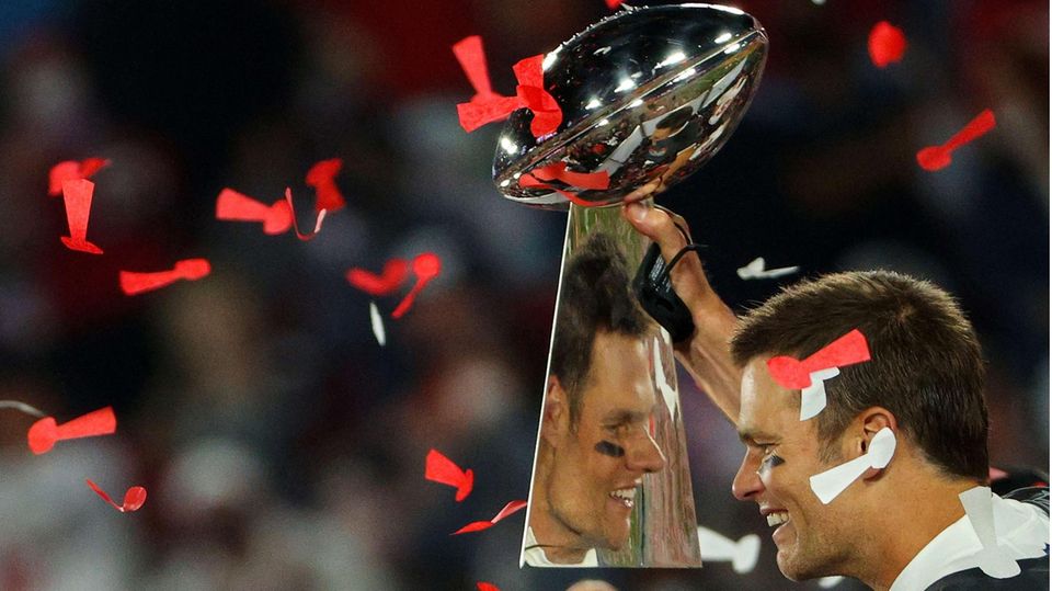Tampa Bay Buccaneers quarterback Tom Brady with Lombardi Trophy, Super Bowl winner's trophy