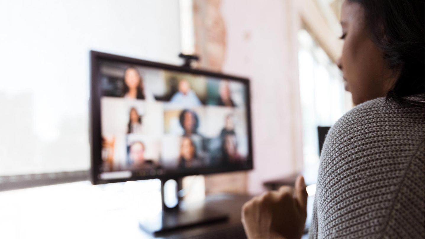 A woman takes part in a video conference