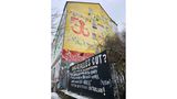 Politische Botschaften an einer Hauswand in der Hafenstraße. Die ehemals besetzten Häuser werden heute von einem selbstverwalteten Wohnprojekt genutzt.