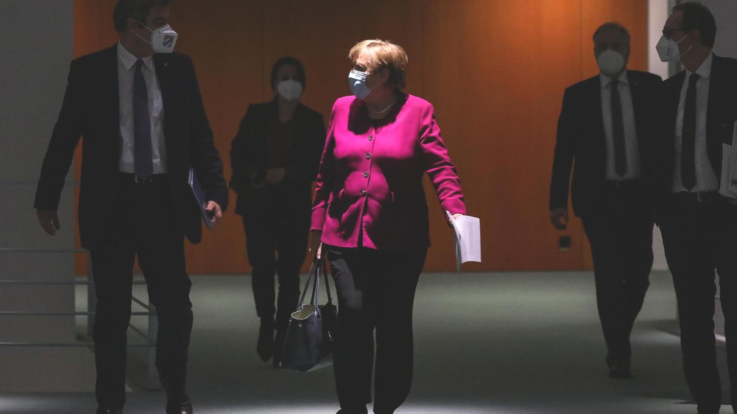 BERLIN, GERMANY - MARCH 03: German Chancellor Angela Merkel (C), Bavarian Premier Markus Soeder (L) and Berlin Mayor Michael Mueller (R) arrive to a press conference after a virtual meeting between Merkel and the leaders of Germany's 16 states duri... Angela Merkel