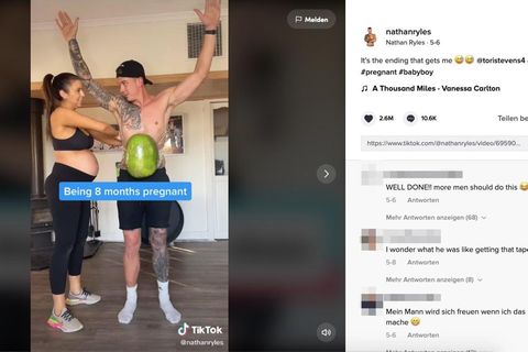 Schwangere bindet ihrem Männern Wassermelonen um den Bauch
