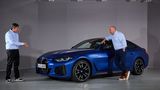 Projektleiter David Alfredo Ferrufino Camacho (links) erklärt die Details des BMW i4 M50