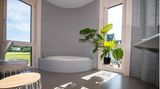 Im Badezimmer des ersten 3D Druckhauses sieht man eine in die Wand eingelassene Badewanne.