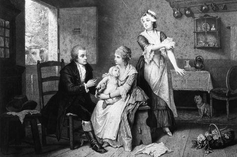 Ein Holzstich nach einem Gemälde von Edouard Hamman zeigt, wie der der englische Landarzt Edward Jenner 1796 bei einem achtjährigen Jungen die erste Impfung gegen Pocken durchführt.