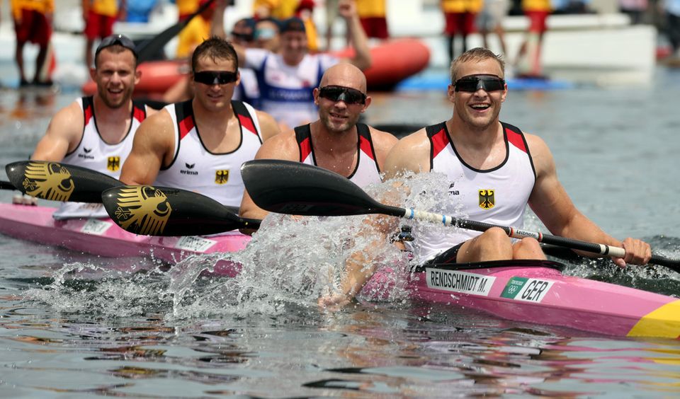 Kayak foursome from Germany with Max Rendschmidt, Ronald Rauhe, Tom Liebscher and Max Lemke (from right) cheering for gold