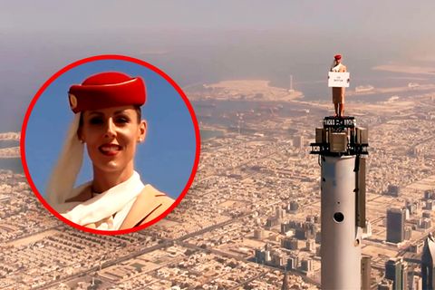 Burj Khalifa: Stewardess steht auf dem höchsten Gebäude der Welt.