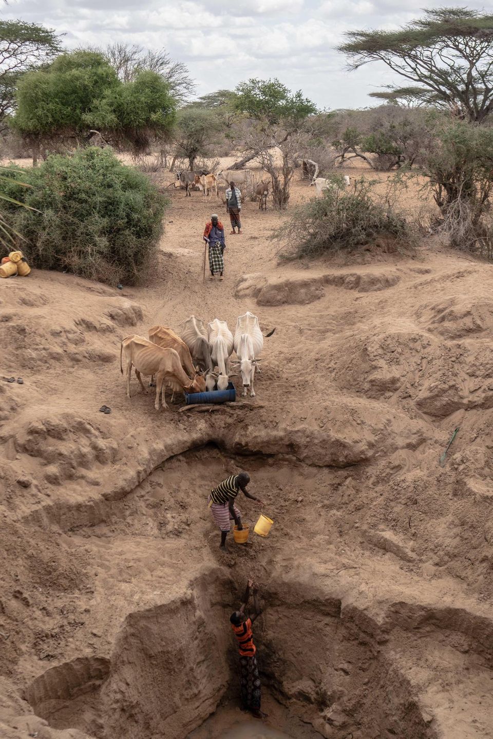 These men in Tana River have to dig up to four metres to find water. The county is one of the most affected by the current drought
