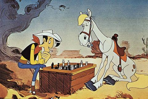 Lucky Luke und Jolly Jumper sitzen über einer Partie Schach
