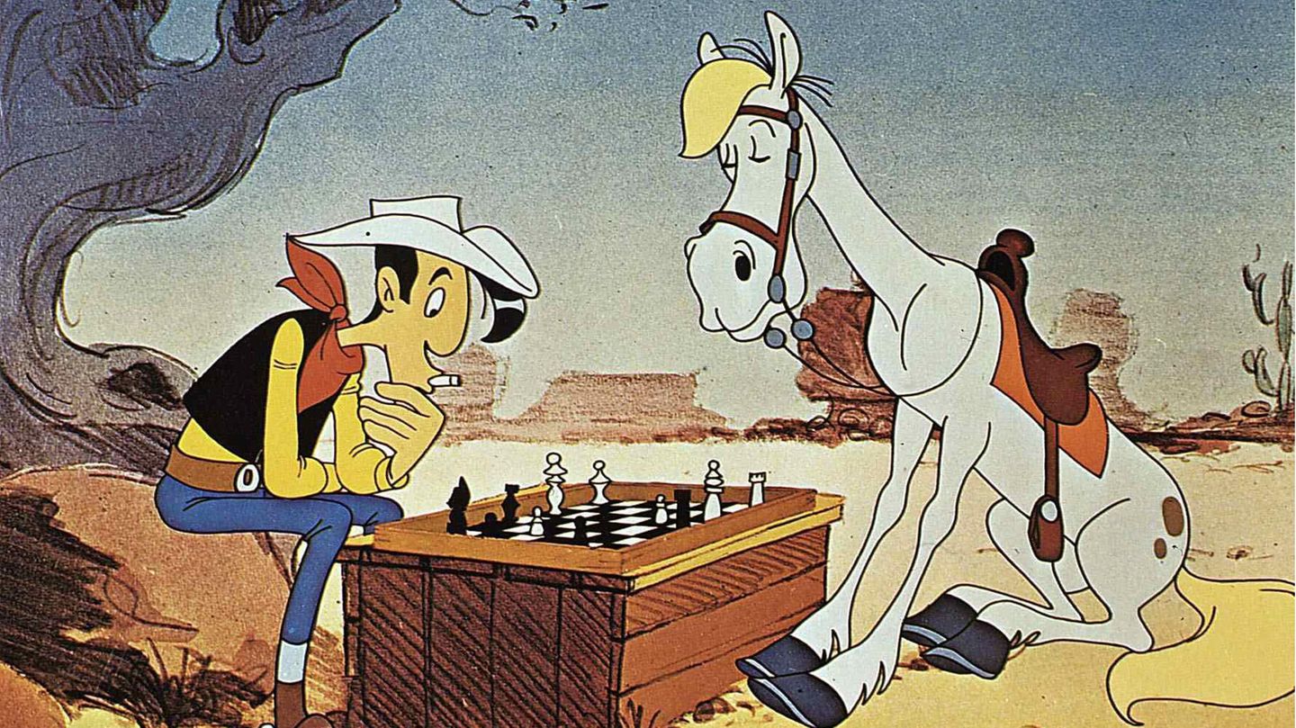 Lucky Luke und Jolly Jumper sitzen über einer Partie Schach