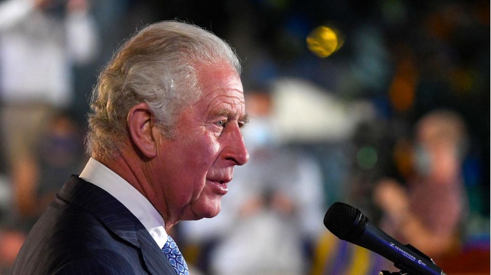 Prince Charles speaks about slavery in Barbados Prince Charles on a microphone