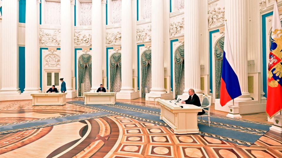 Vladimir Putin and the two leaders of the so-called People's Republics sign the declarations of independence in the Kremlin Vladimir Putin and the two leaders of the so-called People's Republics sign the declarations of independence in the Kremlin