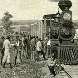 Männer warten vor einer Lokomotive, die nicht mehr fährt. Sie sind auf dem Welt in den Yellowstone Nationalpark. Bild von 1891