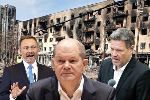 Lindner, Scholz und Habeck auf dem Hintergrund der zerbombten ukrainischen Stadt Mariupol