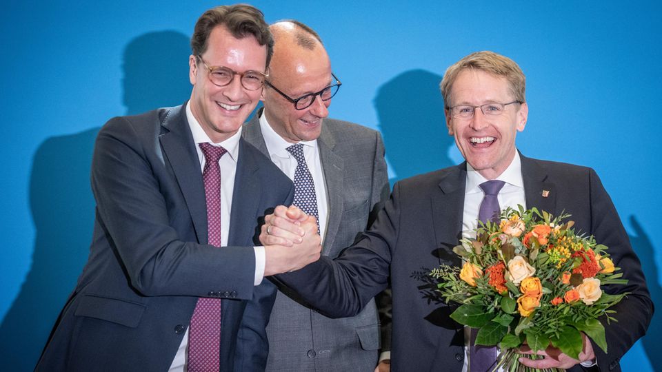 Hendrik Wüst, Friedrich Merz und Daniel Günther nach Wahlsieg in  Schleswig-Holstein