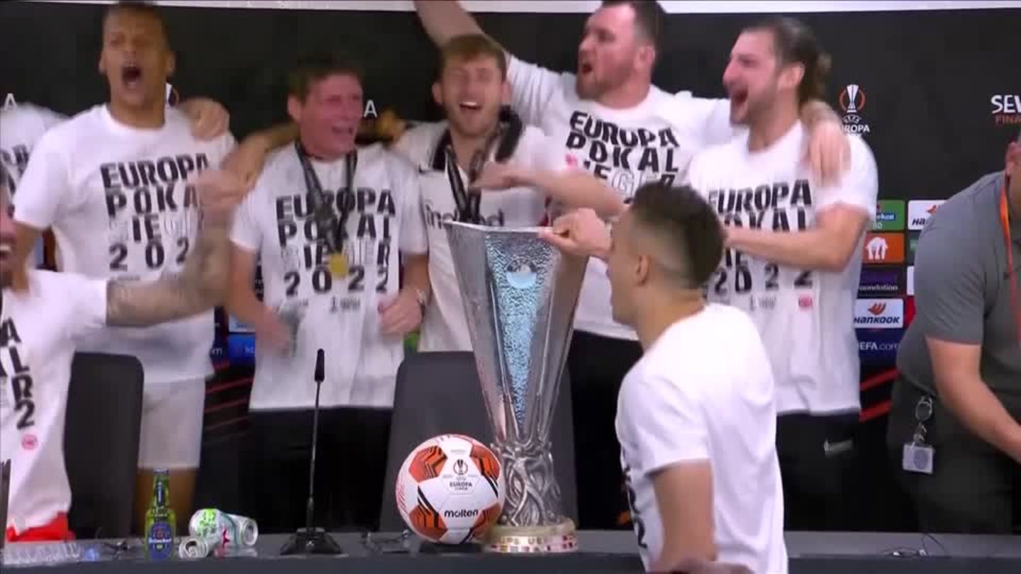 Eintracht Frankfurt players celebrate with a beer shower for Glasner