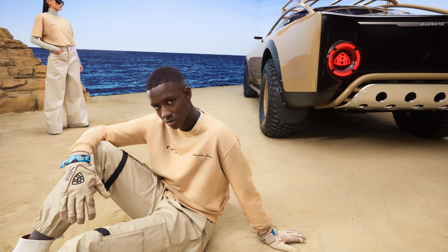 Kleine Details wie das Logo in den Rückscheinwerfern zeigen, wie sehr sich die Designer mit dem Luxus-Offroader Mühe gegeben haben. Die Kleidung der Models soll ebenfalls verkauft werden.