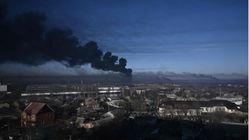 Smoke rises above the Chuhuiv military airport near Kharkiv, Ukraine's second largest city