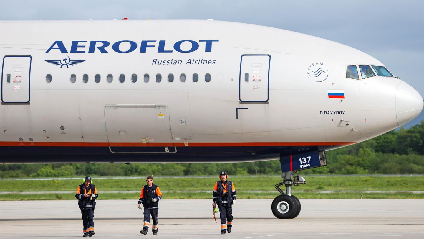 An Aeroflot passenger plane is parked at an airport