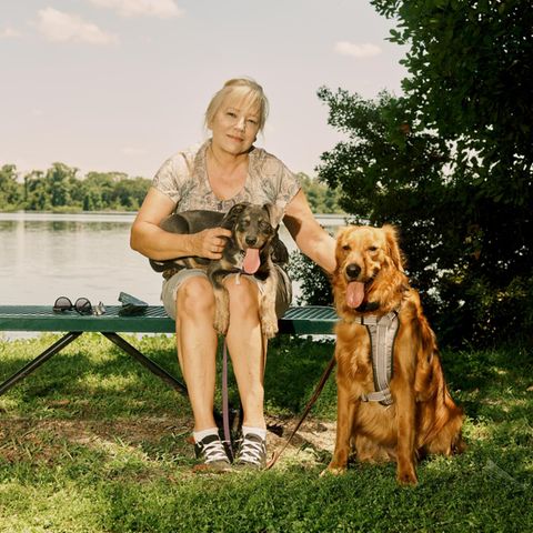 Debra Milke poses for a portrait with her two dogs, Cairo and Abbey, in a park near her neighborhood in Plant City, Florida on Sunday, May 29, 2022.
(Zack Wittman for Stern)