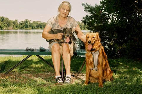 Debra Milke poses for a portrait with her two dogs, Cairo and Abbey, in a park near her neighborhood in Plant City, Florida on Sunday, May 29, 2022.
(Zack Wittman for Stern)