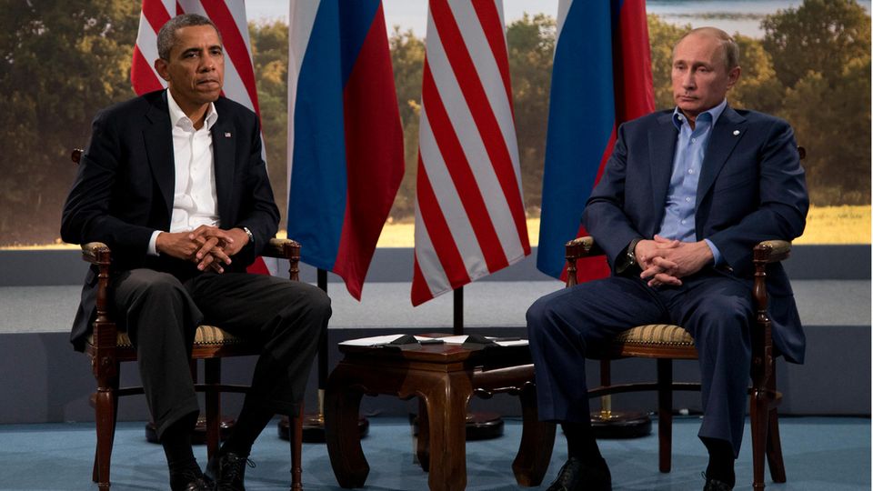 Der frühere US-Präsident Barack Obama (l.) und Russlands Präsident Wladimir Putin
