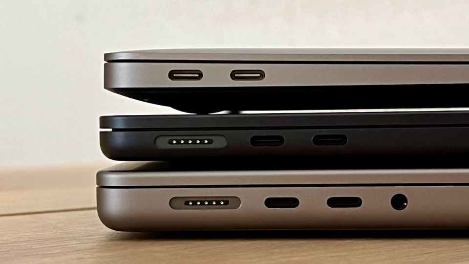 Compared to the previous model (above) and the 14-inch Macbook Pro (below), the Macbook Air is visibly slimmer.  Good to see here: The Magsafe connection for the charging cable