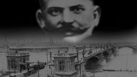 Das Gesicht von Bela Kiss über der Margarethenbrücke