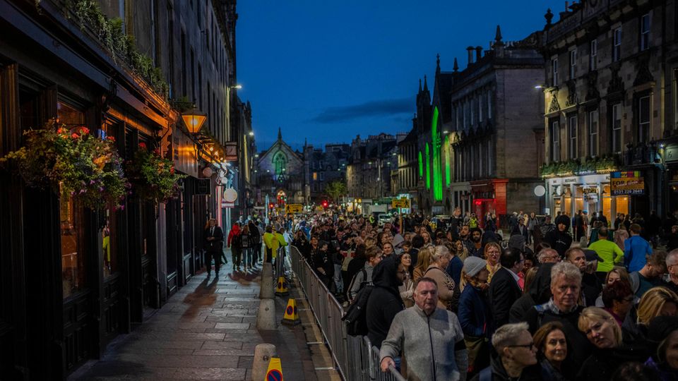 People queue to see the coffin of Queen Elizabeth II resting at St Giles Cathedral in Edinburgh, Scotland.