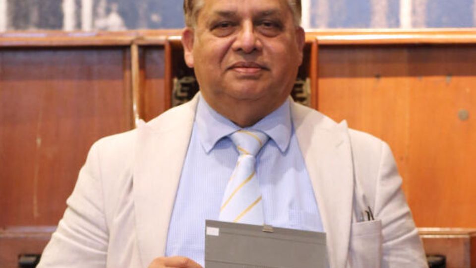 Giandev Moteea, director of the Postal Museum in Mauritius, holds the stamp in his hands Giandev Moteea, director of the Postal Museum in Mauritius, holds the stamp in his hands
