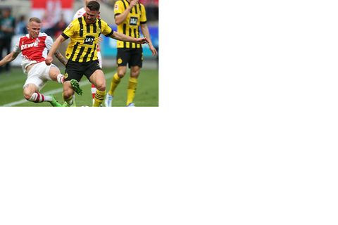Dortmund's Salih Özcan, (R), and Cologne's Ondrej Duda, (L...
