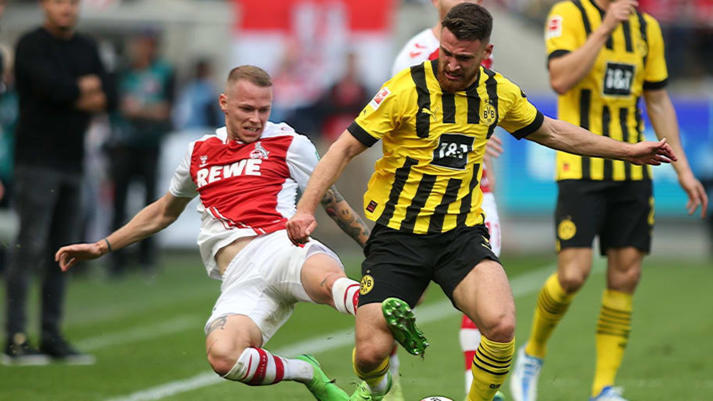 Dortmund's Salih Özcan, (R), and Cologne's Ondrej Duda, (L...