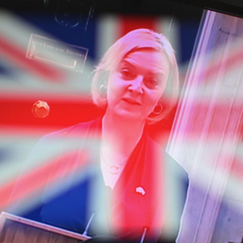Liz Truss fades away behind the Union Jack