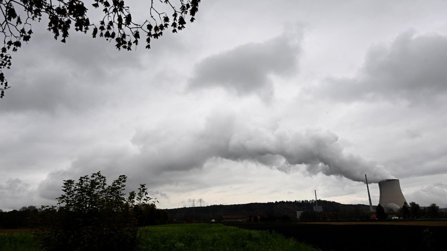 Steam rises from the cooling tower of the Isar 2 nuclear power plant in the Landshut district