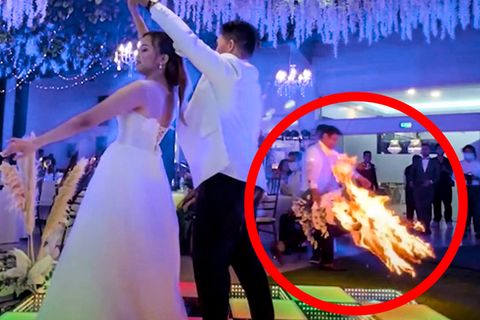 Brautpaar tanzt romantisch – doch der Star des Hochzeits-Videos ist das Feuer im Hintergrund