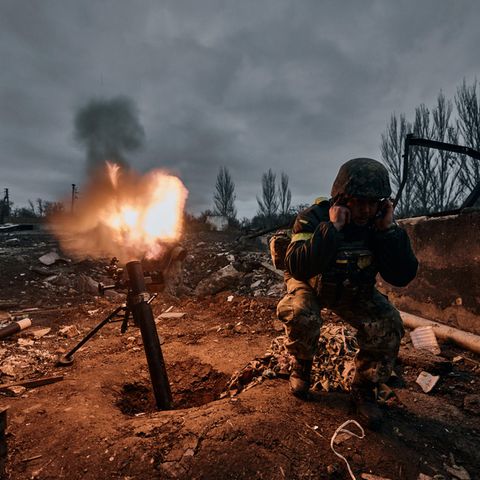 Soldier fires a mortar