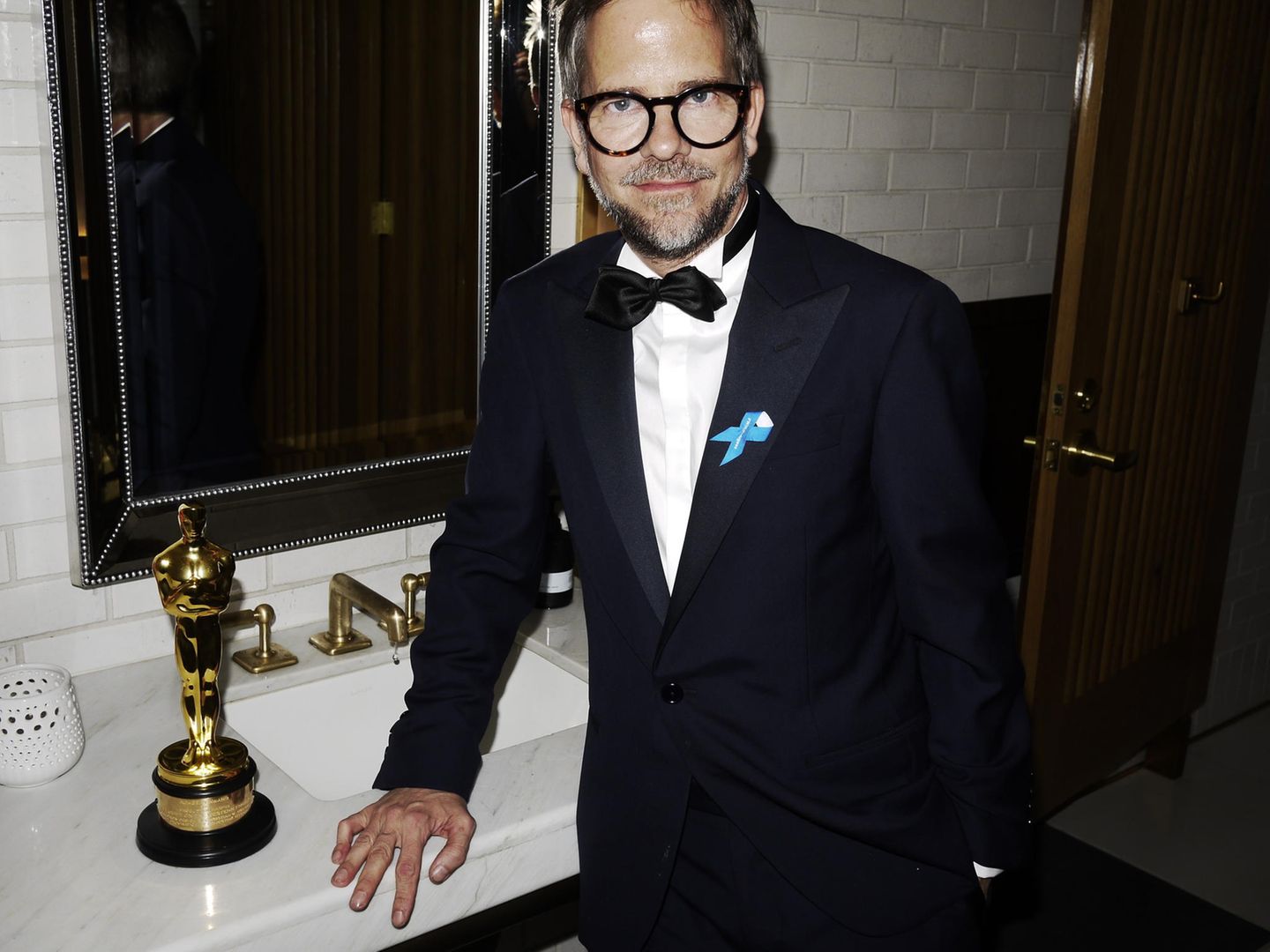 Szenenbildner Christian M. Goldbeck mit dem Oscar.