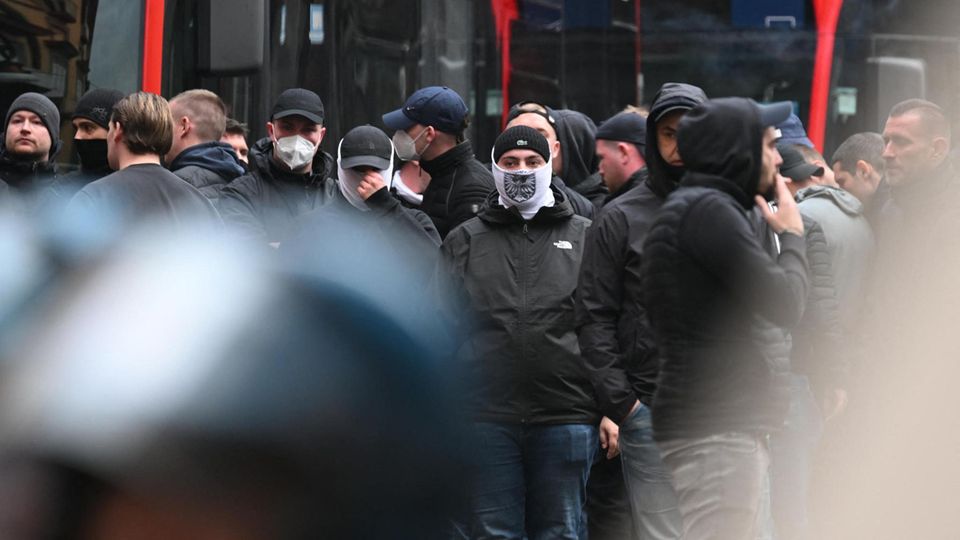 Eintracht Frankfurt stand between Italian riot police and red-painted buses