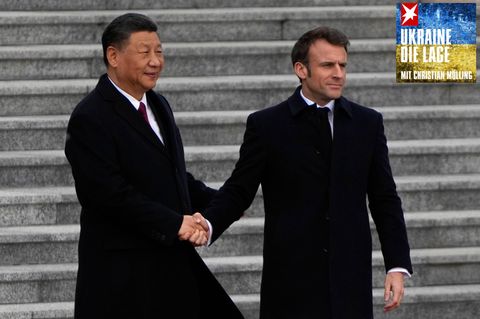 Ein etwas verkrampfter Händedruck: Chinas Staatschef Xi Jinping und der französische Präsident Emmanuel Macron
