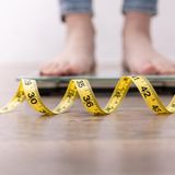 Person auf einer Waage