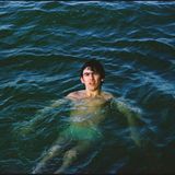 George Harrison der Beatles beim Baden im Meer