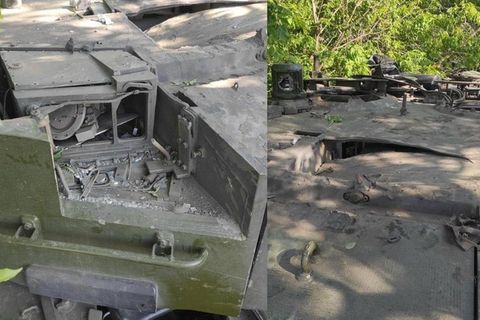Russische Soldaten bei dem Wrack eines Leopard 2A4