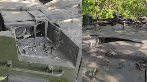 Russische Soldaten bei dem Wrack eines Leopard 2