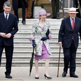 Zu einer der letzten Gartenpartys, die Queen Elizabeth II. im Frühsommer 2022 ausrichtet, erscheint Prinzessin Anne in Begleitung ihres Ehemanns Sir Timothy Laurence (l.). Sie trägt Handschuhe, andere Pumps und einen anderen Hut, aber der farbenfrohe Look ist derselbe wie bei der Cambridge-Hochzeit. Nur elf Jahre später
