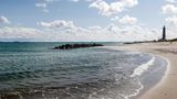 Ostseestrand mit Leuchtturm in Skagen, Dänemark