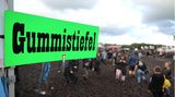 Grünes Schild mit der Aufschrift Gummistiefel