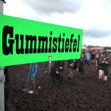 Grünes Schild mit der Aufschrift Gummistiefel