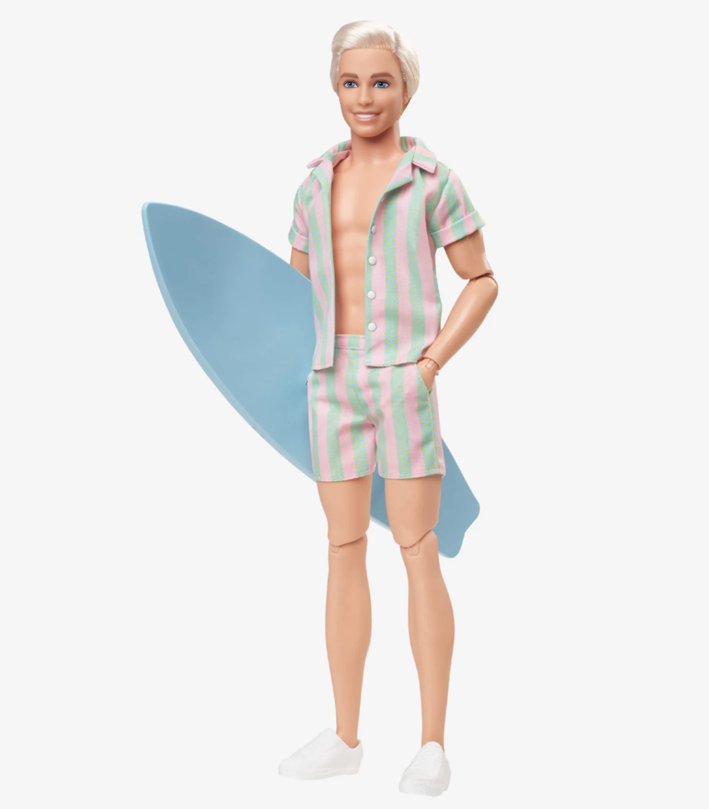 Auch Puppen-Ken hat den Strand gerne. Im rosa-türkis gestreiften Zweiteiler samt Surfbrett versucht er Barbie zu beeindrucken.