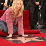 Ihre ersten Alben folgten Ende der 1990er Jahre. Das 1999 veröffentlichte Album "... Baby One More Time" mit dem gleichnamigen Titelsong darauf wurde zum Welthit und wanderte in zahlreichen Ländern auf Platz 1 der Musik-Charts. Ihr dazugehöriges Musikvideo, in dem sie im ikonischen Schulmädchen-Look mit Zöpfen und Karorock zu sehen ist, ging um die Welt und machte sie über Nacht zum Mega-Star. Auch ihr nächster Hit "Oops! ... I Dit It Again" lief mit knapp 25 Millionen verkauften Einheiten genauso gut. Die "Princess of Pop" war geboren – und erhielt im Jahr 2003 als bislang jüngste Sängerin einen Stern auf dem Walk of Fame in Hollywood.