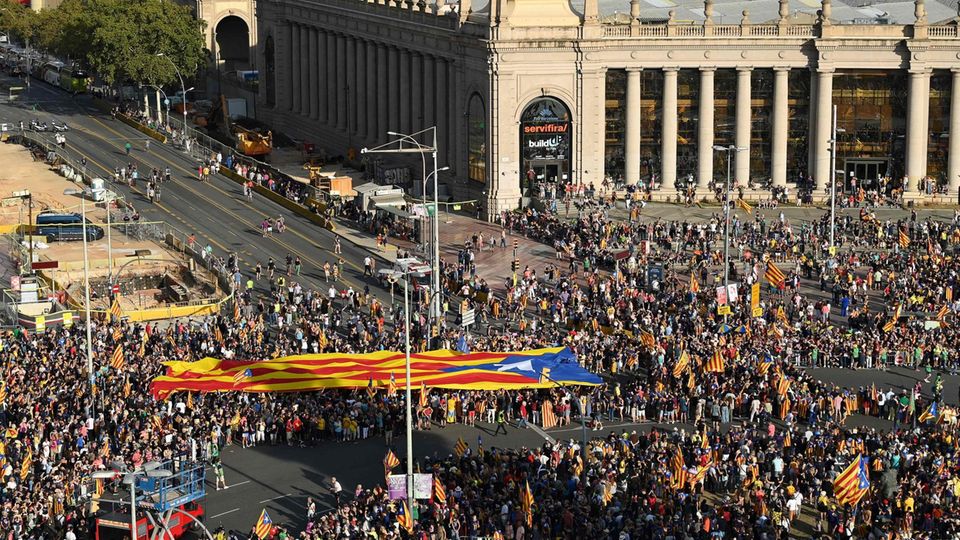 Catalonia Barcelona Spain Demonstration from above Demonstrators wave a giant Catalan independence flag during the “Diada” celebrations in Barcelona
