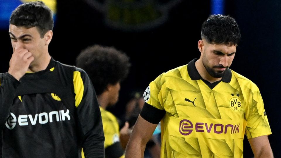 Emre Can lässt nach der Niederlage in Paris den Kopf hängen, ganz passend zur allgemeinen Stimmung beim BVB